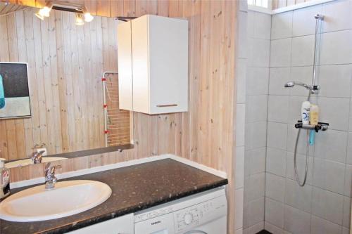 a bathroom with a sink and a shower at LF15018-Skals-Lynderup-Strand-4 in Skals