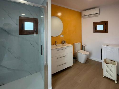 a bathroom with a shower and a sink and a toilet at casa Angelita in Mourillones