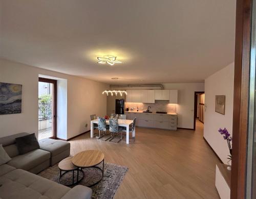 a living room with a couch and a table at Rosa dei Venti - Como Lake House in Valmadrera