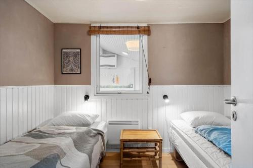 a bedroom with two beds and a window at LF391-Vestervig-Gunhildsvej-1 in Vestervig