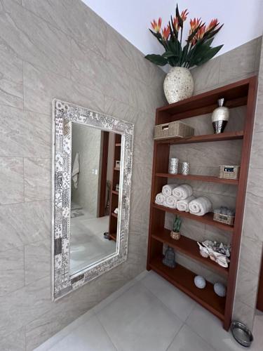 a mirror on a wall in a room at Villa Montemar Ocean and Mountain Views in Platanillo