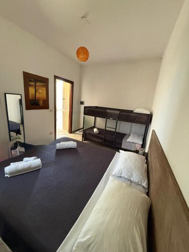 a bedroom with two bunk beds in a room at Villa Sofia in Sogliano Cavour
