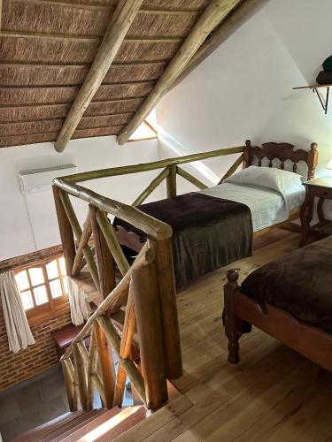 a bedroom with a bed and a table in a room at Cabañas del Paraiso in Colón