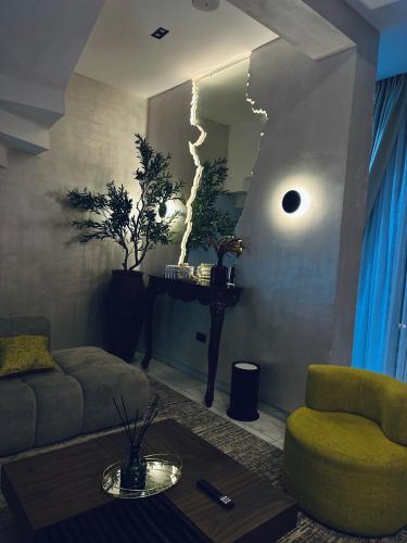 a living room with a couch and a table at Diah Homes Apartment in Benin City