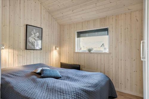a bedroom with a bed and a window at LF15028-Skals-Lynderup-Strand-6 in Skals