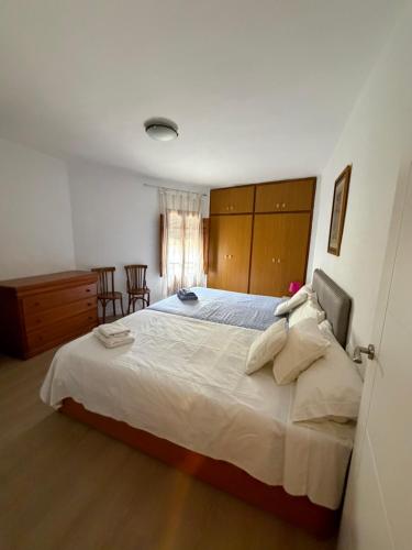 a bedroom with a large bed in a room at Casa Emilia in Talayuelas