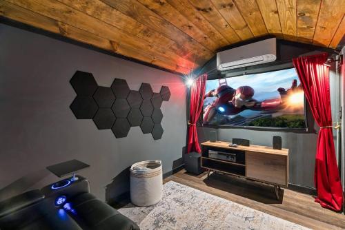 Cute Couples Cabin with Hot Tub Theater Fire Pit photo 3
