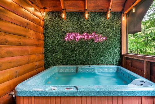Cute Couples Cabin with Hot Tub Theater Fire Pit photo 4