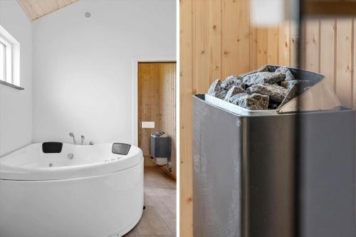 a bathroom with a trash can and a sink at LF14344-Roslev-Folvigvej-44 in Roslev