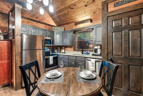 Cute Couples Cabin with Hot Tub Theater Fire Pit photo 13