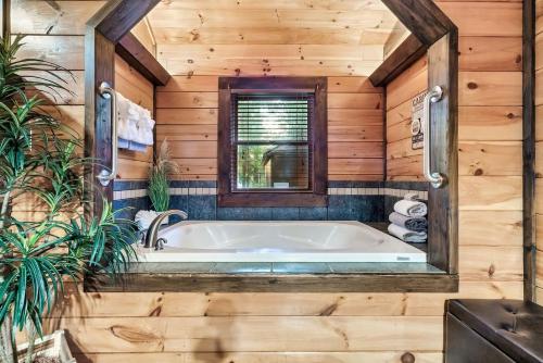 Cute Couples Cabin with Hot Tub Theater Fire Pit photo 7