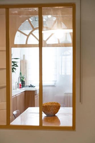 a bowl sitting on a table in a kitchen at Le cocoon de Pome et Leon in Perpignan