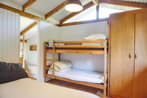 a bedroom with bunk beds in a room at 13405-1-Hojby-Avaenget-1 in Højby