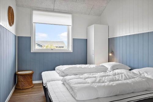 a bedroom with two white beds and a window at LF12003-Spottrup-Molleparken-32 in Spottrup