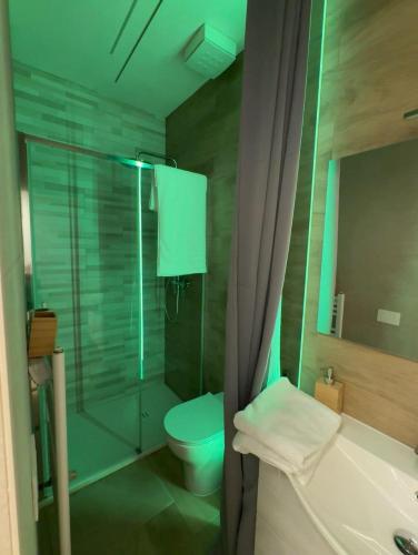 a bathroom with a glass shower and a toilet at Stazione 21 - Pescara Loft in Pescara