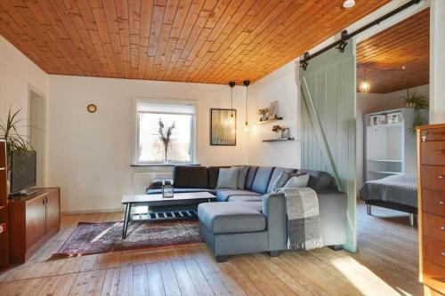 a living room with a couch and a table at LF10313-Hurup-Thy-Fjordstraede-13 in Doverodde