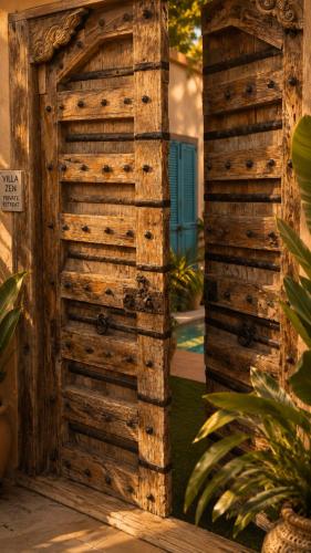 a wooden door in the side of a house at פלא - PELEH -KASHMIR -Quiet place 3 km from caesarea beach in Or ‘Aqīvāh