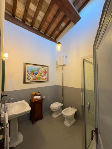 a bathroom with a sink and a toilet and a shower at Le 3 Rane B&B in Treggiaia