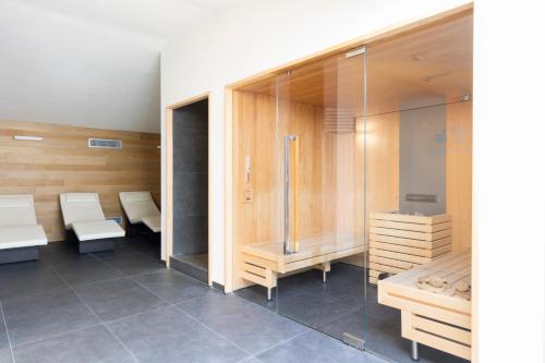 a sauna with benches and tables in a room at Villa Neroli - Place of Charme in Florence