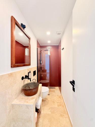 a bathroom with a sink and a toilet at Putechella Slow Living Retrait in Tramonti