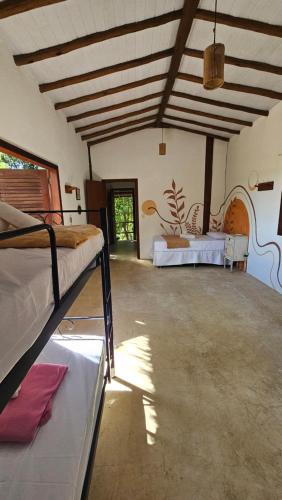 a bedroom with two beds in a room at Casa Jasmim in Marau
