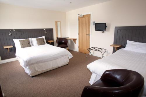 Llit o llits en una habitació de The Arch Inn