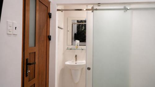 a bathroom with a sink and a mirror at Beauty House in Ho Chi Minh City