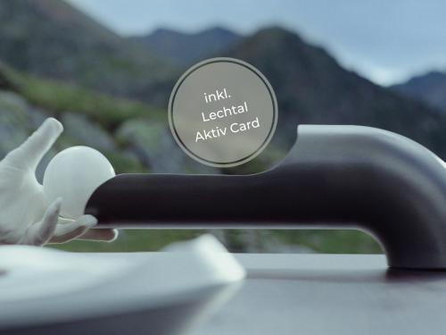 a close up of a black faucet at VAYA Lechtal in Elbigenalp