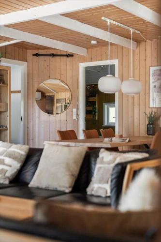 a living room with a couch and a table at 2556-Romo-Kromosevej-15 in Høm