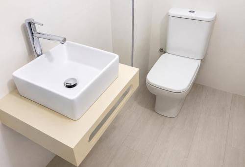 a bathroom with a white sink and a toilet at TARONGERS 7 in Peniscola