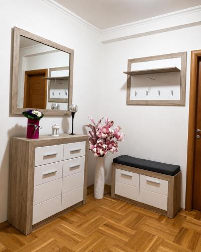 a bathroom with a sink and a mirror at Prizma in Cetinje