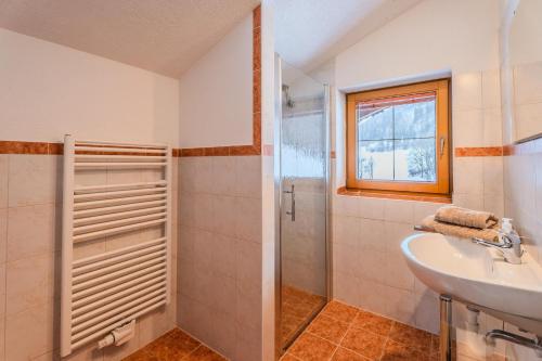a bathroom with a sink and a shower at Appartements Kaltenbach in Kaltenbach