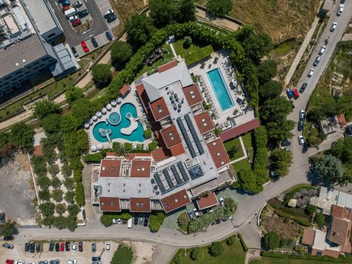 an overhead view of a building with a pool at Hotel President Solin in Solin
