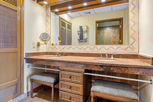 a bathroom with two sinks and a large mirror at Holiday Inn Club Vacations Royal Haciendas All Inclusive in Playa del Carmen