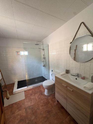 a bathroom with a shower and a toilet and a sink at Villa CarlaSophia in Calasparra