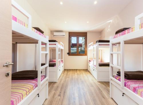 a group of bunk beds in a room at Rethymno Youth Hostel in Rethymno