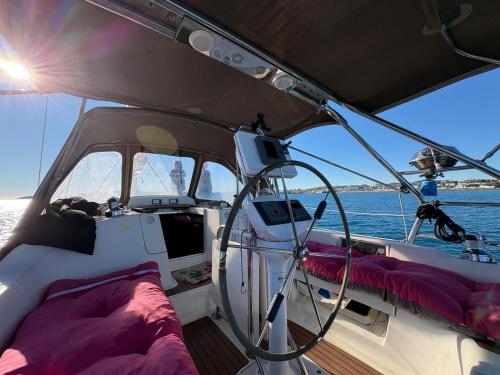 a boat with a bed on the side of it at Echappée belle in Cros-de-Cagnes