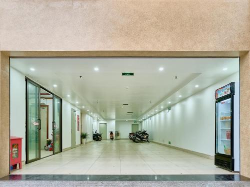an empty hallway of a building with motorcycles in it at NEW SUN NAM ĐỊNH hotel in Nam Ðịnh