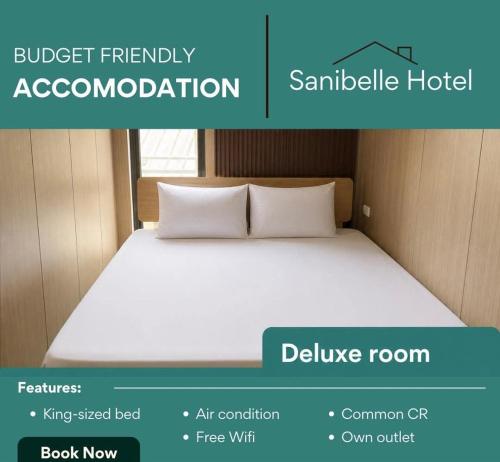 ein Bild von einem Bett in einem Zimmer in der Unterkunft Sanibelle Hotel in Coron