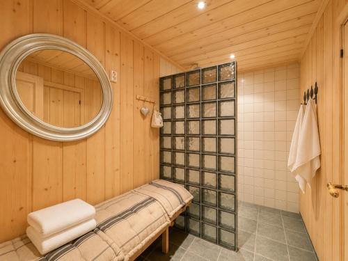 a bathroom with a mirror and a shower at Spacious cabin with beautiful Geilo views in Geilo