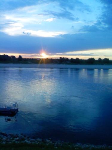 a boat in the middle of a large lake at Agriturismo Antica Golena in Guastalla