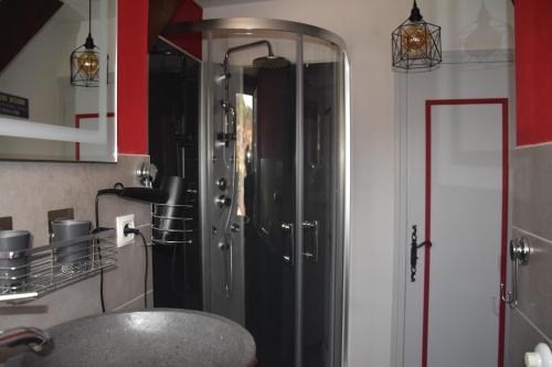 a bathroom with a sink and a shower at Pause Périgord in Saint-Cyprien
