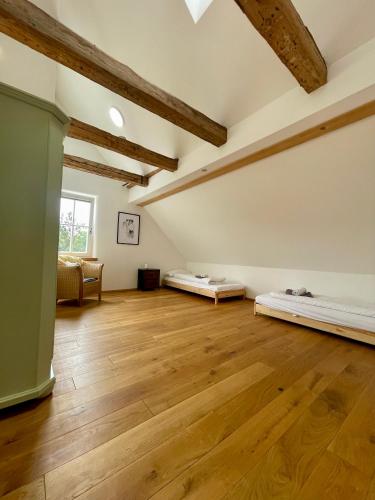 an empty room with two mattresses on a wooden floor at Belmonte in Sulzbach-Rosenberg