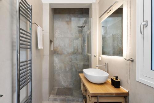 a bathroom with a sink and a shower at Yi Garden Corfu in Corfu