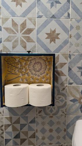 two rolls of toilet paper on a wall in a bathroom at Masseria Mustazzo in Siponto