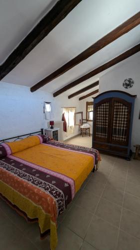 a bedroom with a large bed in a room at Masseria Mustazzo in Siponto