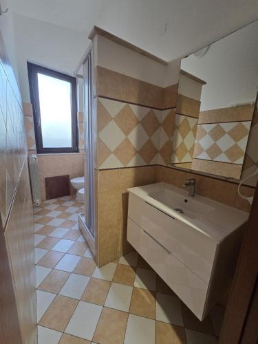 a bathroom with a sink and a toilet at B&B Sant'Anna in Lercara Friddi