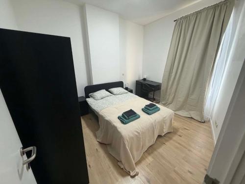 a bedroom with a bed with two pillows on it at 1 Chambre Moyenne avec television in Charleroi