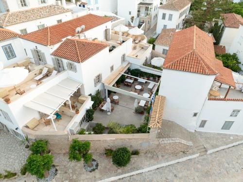 an overhead view of a white house with red roofs at Angelica Traditional Boutique Hotel in Hydra