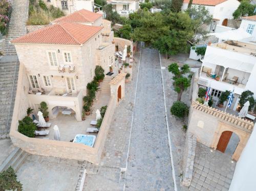 an aerial view of a house with a cobblestone street at Angelica Traditional Boutique Hotel in Hydra